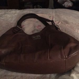 Coach purse. Brown. Shoulder straps. Pink lining.